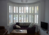 white-shutters-closed-for-a-bay-window-in-berkhamsted