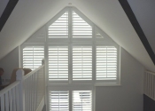 white-shaped-shutters-remote-control