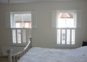 white-portland-shutters-bedroom-st-albans